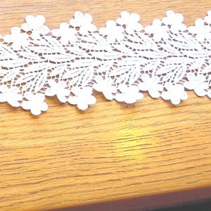 Antique White  lace with floral design. Ideal for a blouse front.  26&quot; long X  3 &quot;  Lace 4047