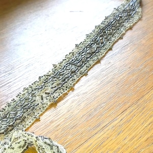 Antique rare beige & silver  beadedtrim. Ideal for embellishment or make a belt .  Some condition issues hence price 24&quot; X 1 1/4 Lace 4182
