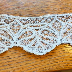 1800s  ivory blonda de ceda cotton deep lace with scalloped edge. 18&quot; long X 2 1/2 &quot; wide Lace 3080