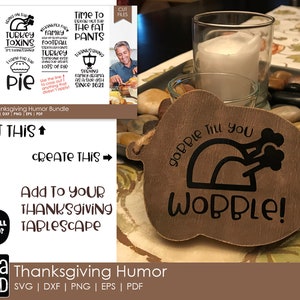 May include: A brown wooden turkey-shaped sign with the text "Gobble Till You Wobble!" in black lettering. The sign is on a table with a candle and rocks.