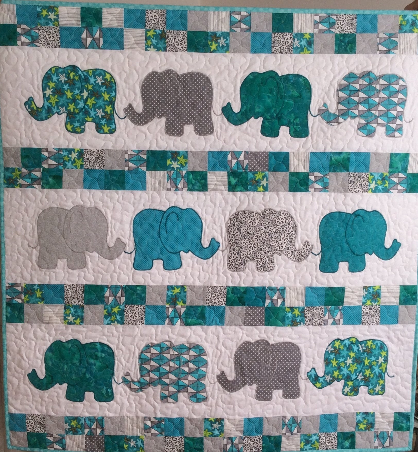 Handmade Teal and grey baby elephants quilt.