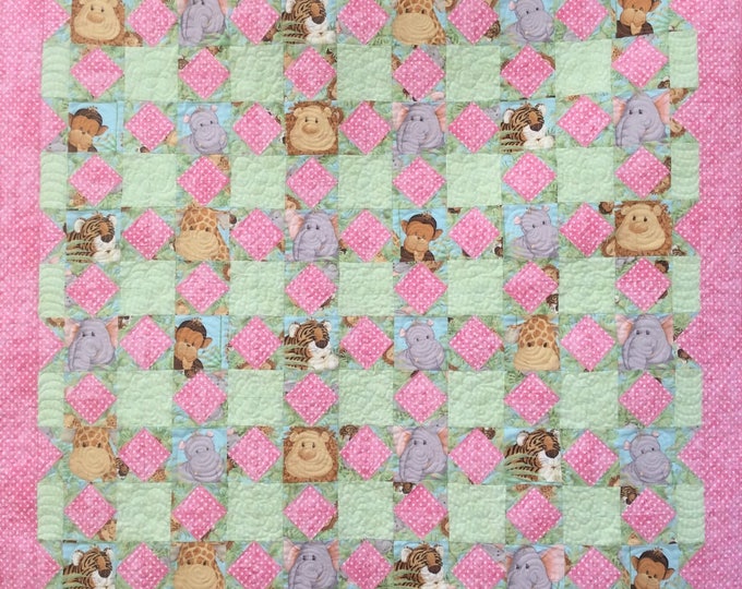 Handmade Jungle Babies quilt.