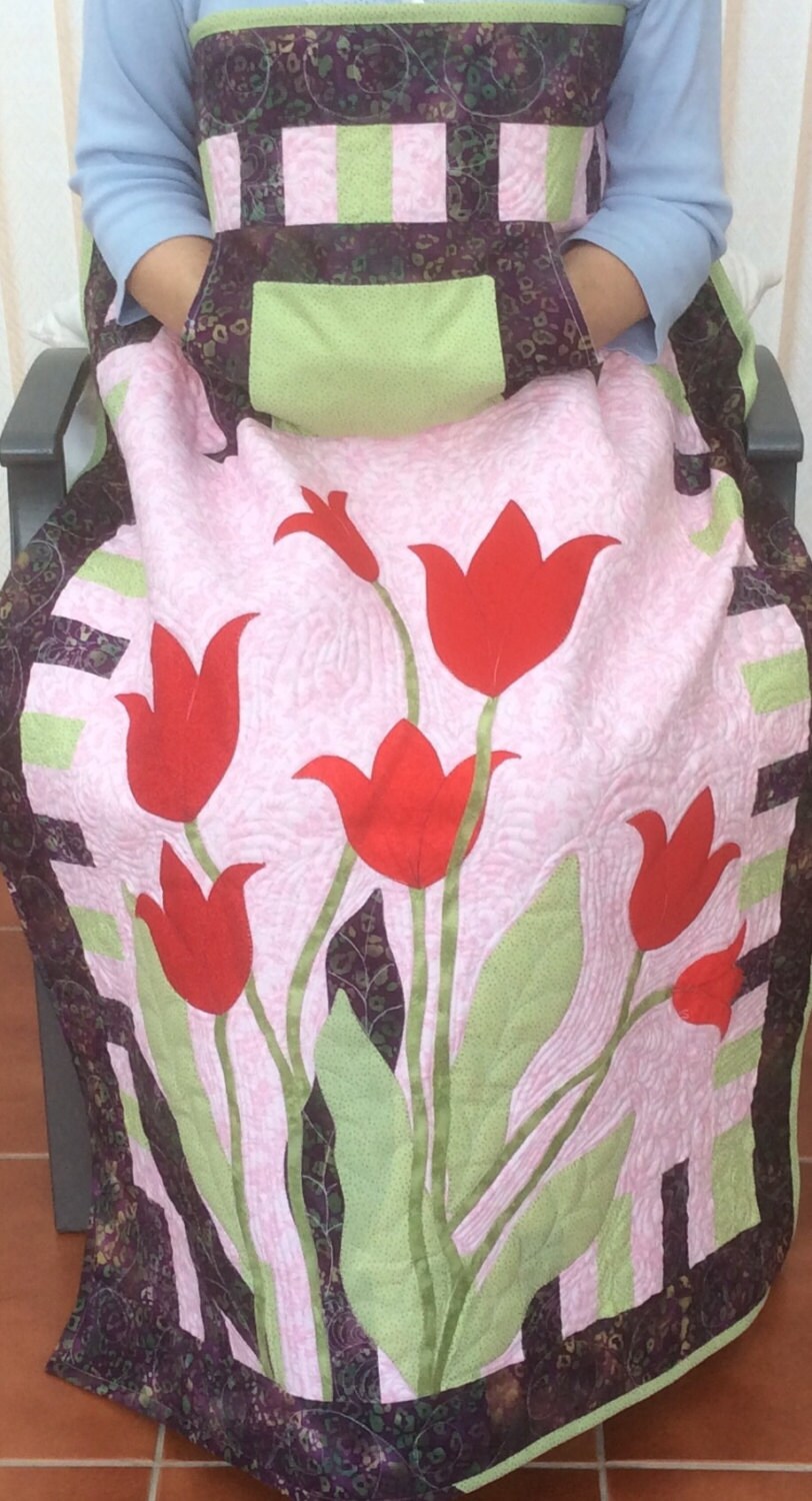 Lap quilt with pockets.