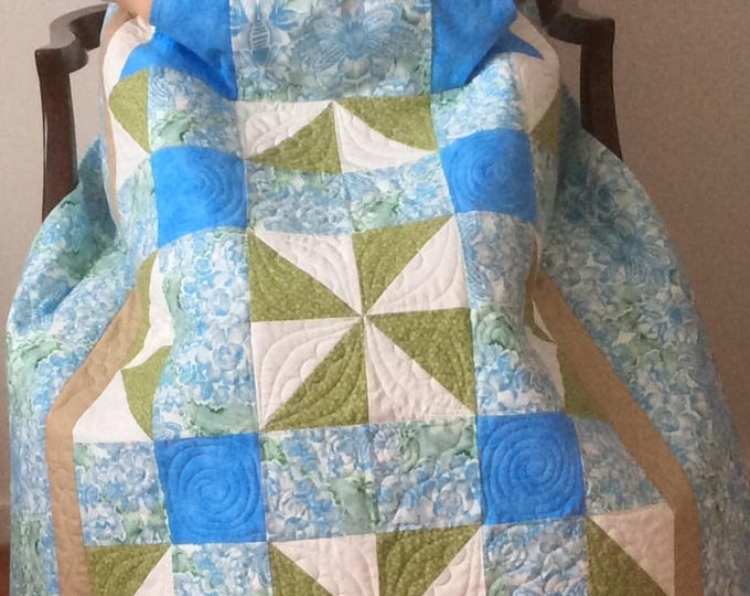 Lap quilt with pockets.