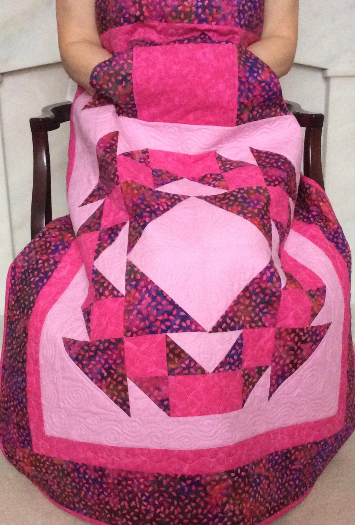 Lap quilt with pockets.