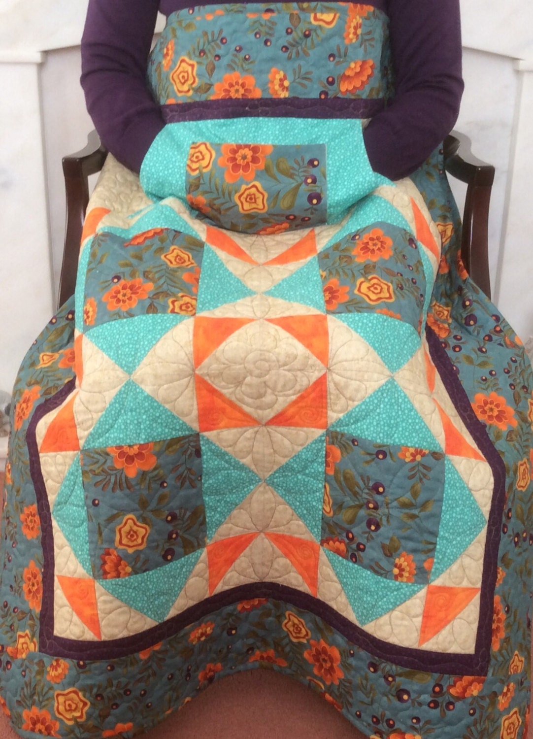 Lap quilt with pockets.