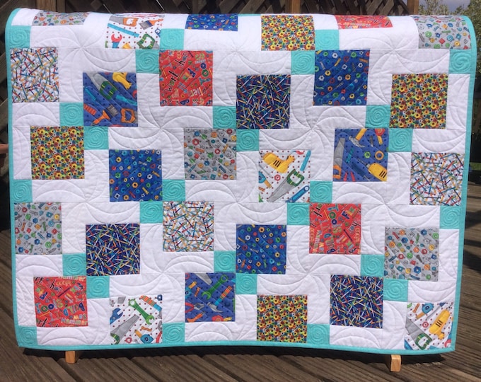 Handmade baby quilt. Disappearing nine patch block.