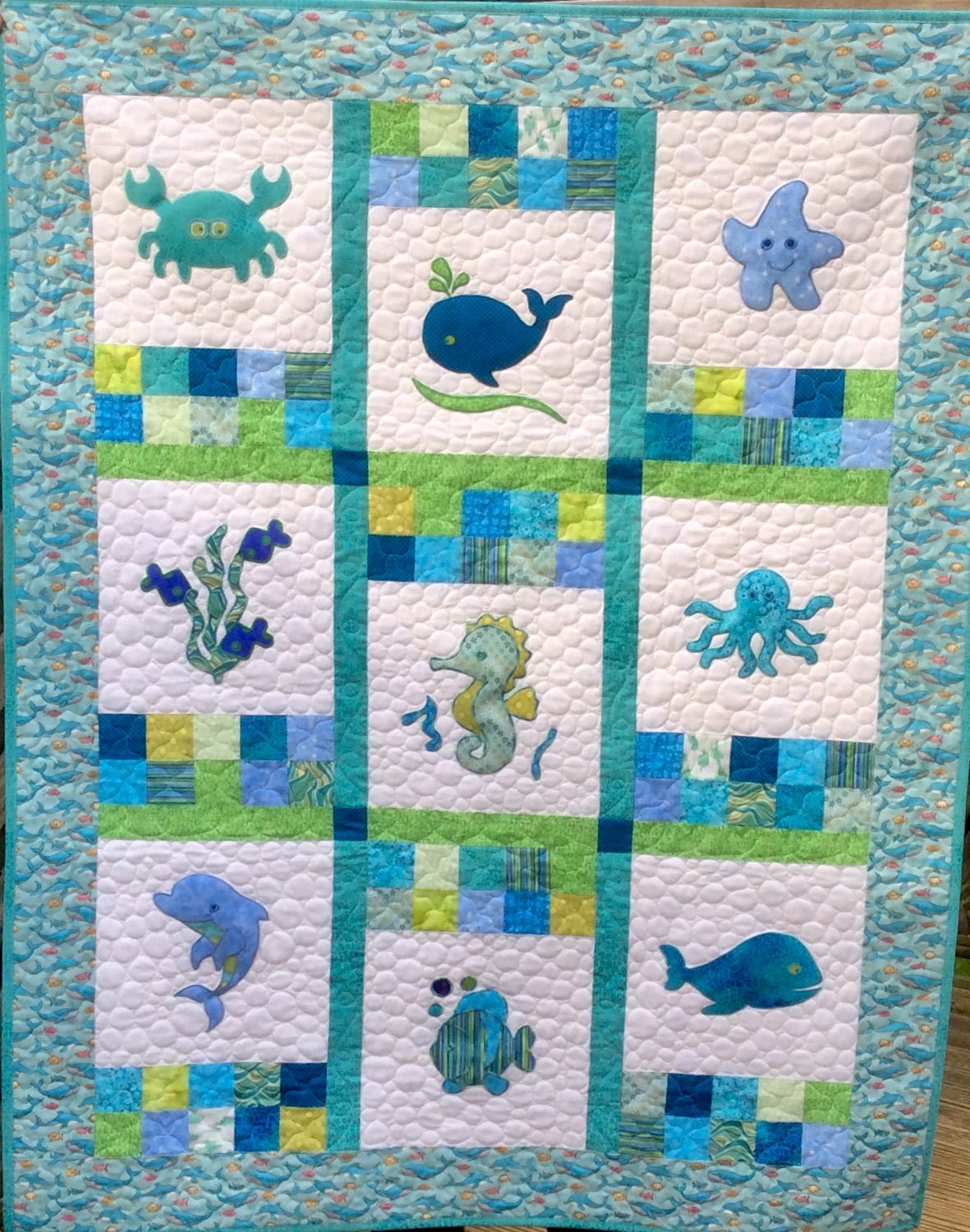 Handmade Under the Sea creatures baby quilt. Blue, Green and White.