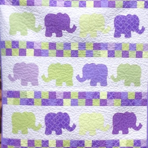 Handmade elephants on parade baby quilt.