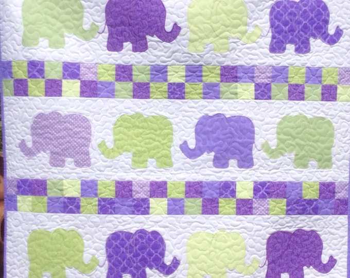 Handmade elephants on parade baby quilt.