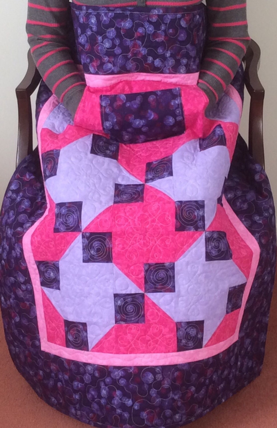 Lap quilt with pockets.