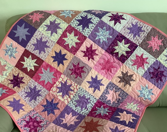 Handmade Twinkling Stars baby quilt. Pink and purple baby blanket.