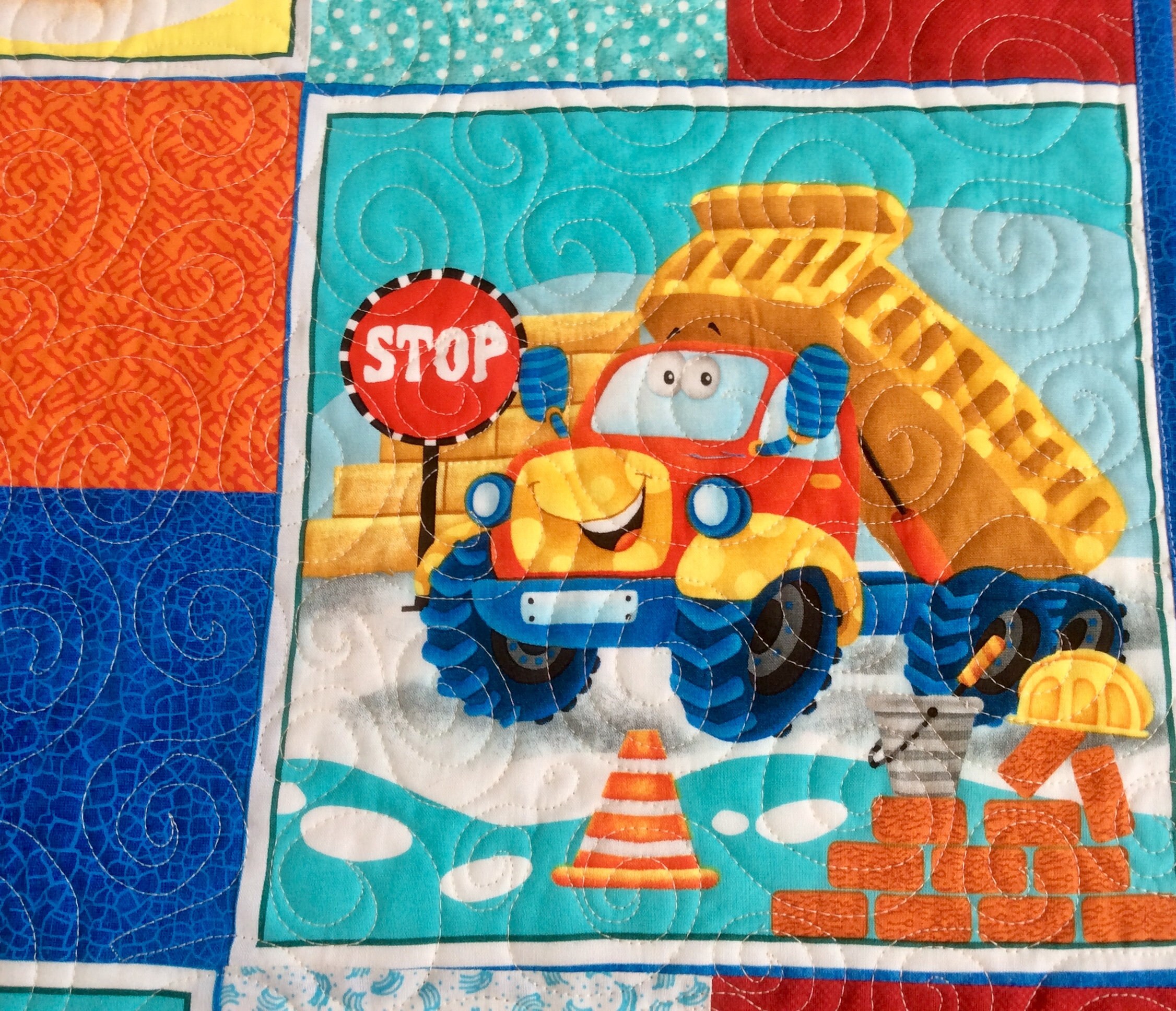 Handmade baby quilt. Happy construction trucks baby quilt.