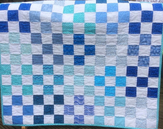 Handmade Nine patch baby quilt in shades of blue.