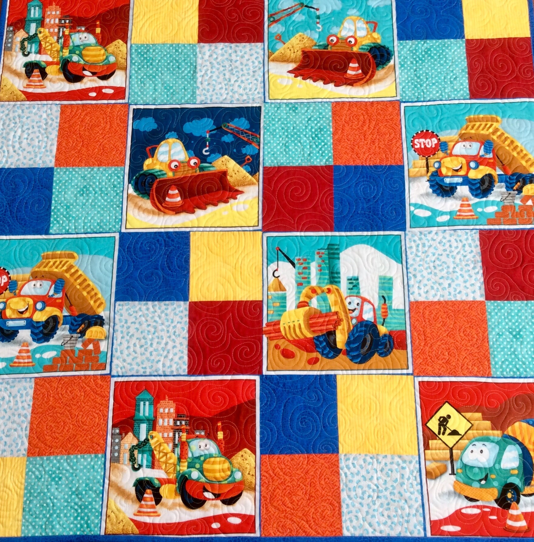 Handmade baby quilt. Happy construction trucks baby quilt.