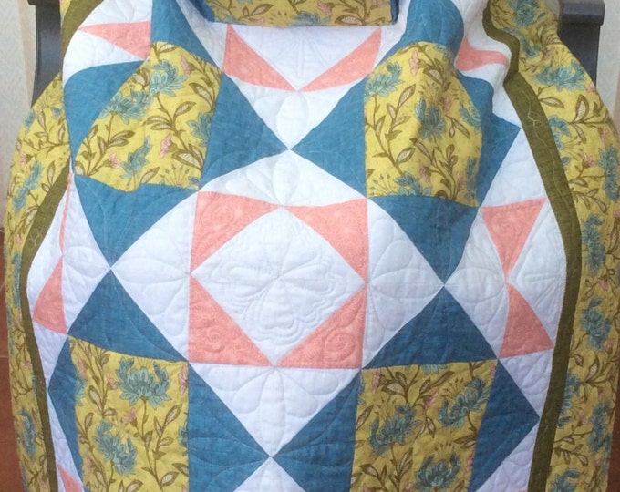 Lap quilt with pockets.