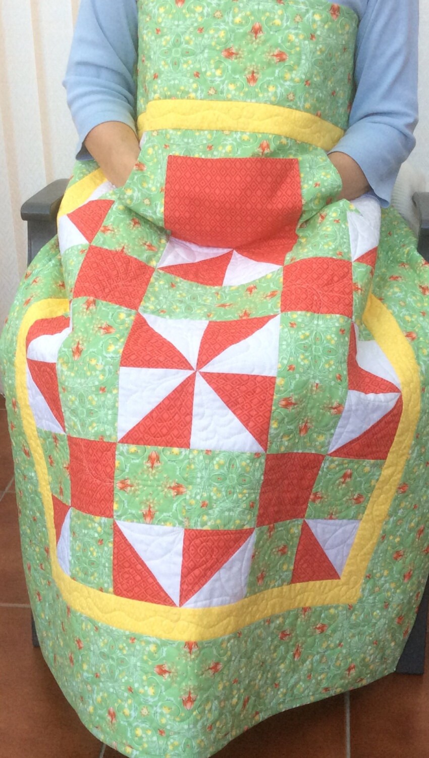 Lap quilt with pockets.