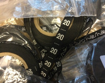 Large Batch of Black Woven Garment sizing Labels.