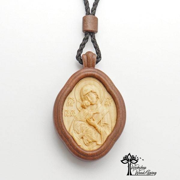 Medallion Saint Mother of God cut out of boxwood and embedded by intarsia into the wood Che, Vladimir icon of the mother of God