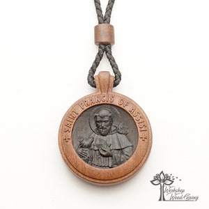 St. Francis of Assisi carved wooden medallion Catholic medallion of two valuable wood St. Francis jewelry, Сhristian Pendant Wood