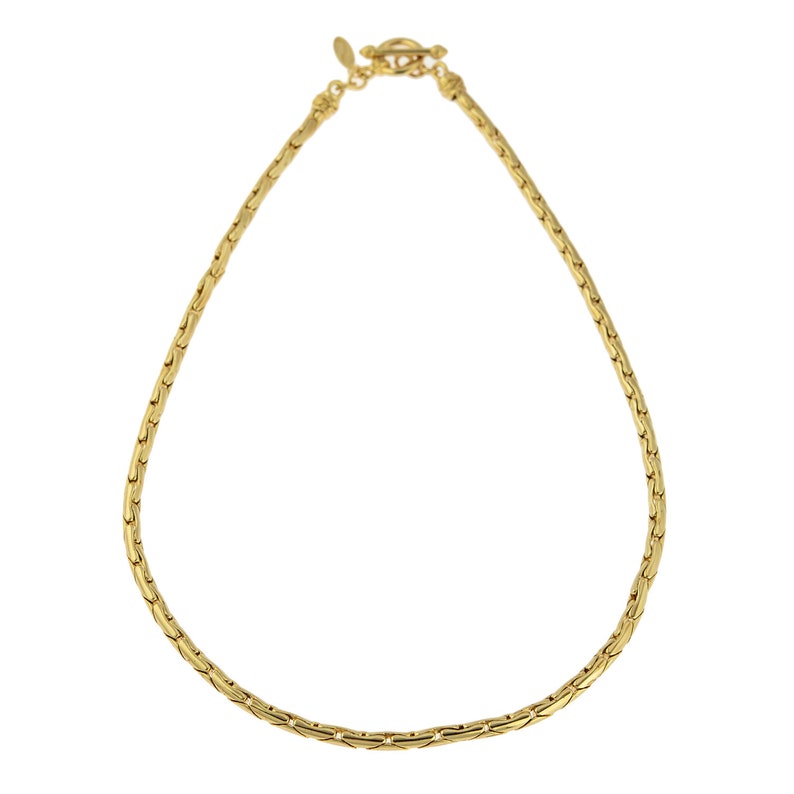 May include: A gold chain necklace with a lobster clasp closure.