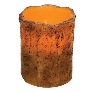 May include: A cylindrical, battery-operated LED candle with a textured, brown and orange exterior. The candle has a flickering, warm orange glow, mimicking a real flame. The candle's design suggests a rustic or natural aesthetic.