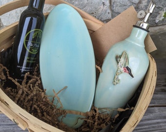 Oil or Vinegar Pottery Jar Basket in Iced Teal glaze with hummingbird sprig, handmade olive oil dispenser in Seagrove NC