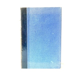 May include: A blue hardcover book with a black spine.