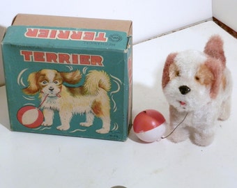 Alps Japan wind up Terrier with ball on string. Has key winds up and wags his tail