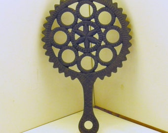 Black Cast Iron pot holder trivet gear circle and star pattern
