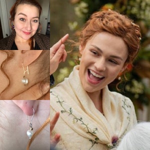 May include: A close-up of a woman wearing a white shawl with green embroidery. She is wearing pearl earrings and has her hair pulled back in a loose updo.