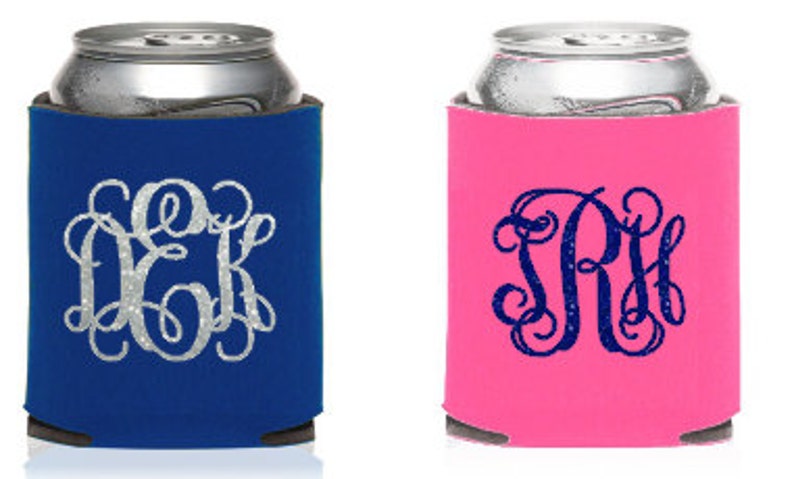 May include: Two personalized can coolers, one blue with silver glitter monogram "DKK" and one pink with blue glitter monogram "SRH".