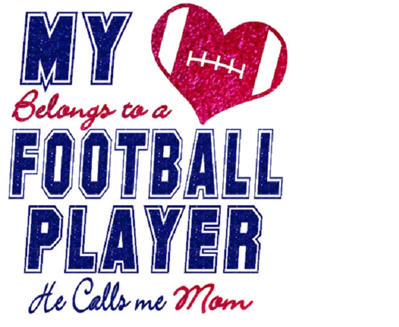 May include: A pink glitter heart with a white football design inside. The text "MY Belongs to a FOOTBALL PLAYER He Calls me Mom" is written in blue and red glitter.