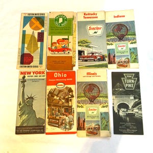 May include: A collection of vintage travel brochures featuring maps and illustrations. The brochures are for various states including New York, Indiana, Ohio, Illinois, Kentucky, Tennessee, and Pennsylvania. The brochures feature the Sinclair gas station logo and the text "Turnpike".