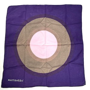 May include: A purple cotton square scarf with a concentric circle design. The circles are brown, pink, and white. The scarf has the text "marimekko" in white lettering in the bottom left corner.