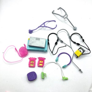 May include: A set of 12 colorful toy medical and electronic accessories, including a stethoscope, headphones, a backpack, and a small electronic device.