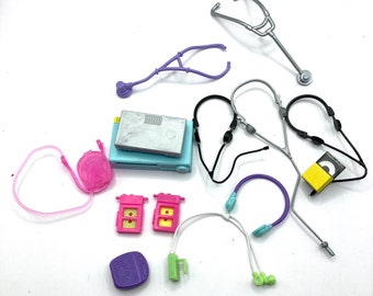 May include: A set of 12 colorful toy medical and electronic accessories, including a stethoscope, headphones, a backpack, and a small electronic device.