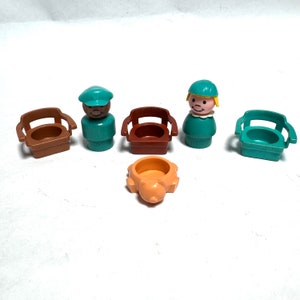 May include: A set of five vintage plastic Little People toys, including two figures, two brown chairs, and a brown and orange potty. The figures are wearing blue and green hats and have painted faces.