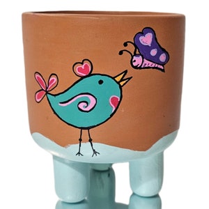 Hand-Painted Terra Cotta Planter: Three-Legged Pot with Bird Design