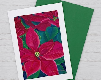 May include: A rectangular greeting card featuring a vibrant illustration of red poinsettia flowers with deep green leaves. The artist's signature, Mary Michael Fiske, is visible in the bottom right corner. A solid green envelope is tucked behind the card.