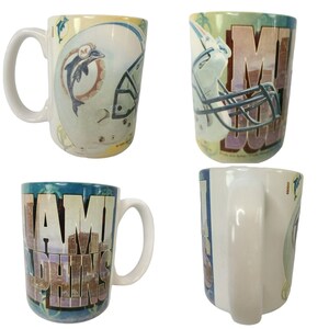 May include: A set of four ceramic coffee mugs featuring the Miami Dolphins logo and team colors. The mugs have different designs, including a helmet, the team name, and a dolphin.