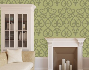 May include: A living room scene with a light green wall adorned with a repeating grey scroll pattern. A white cabinet and beige sofa are on the left. A white fireplace with candles is on the right.