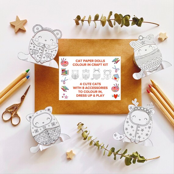 Cute cat paper dolls. 4 cat paper dolls with 8 cosy winter outfits and accessories to colour in, cut out and make. Cat paper craft.