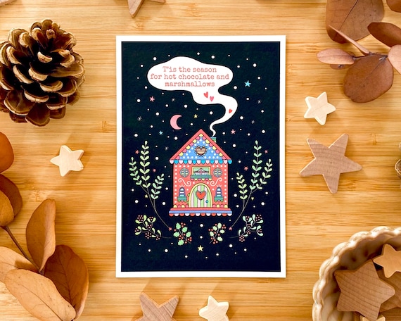 T’is the season for hot chocolate and marshmallows. Cosy winter cottage Christmas card.