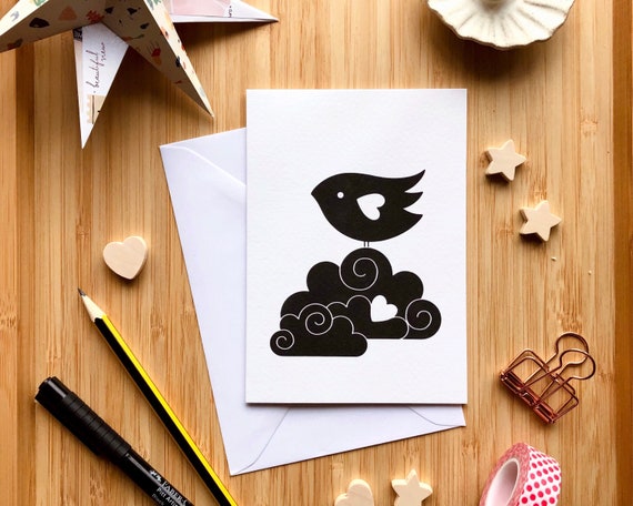 Black bird on a cloud, black and white greeting card. Cute bird card. A bird standing on a fluffy cloud. A6 greeting card