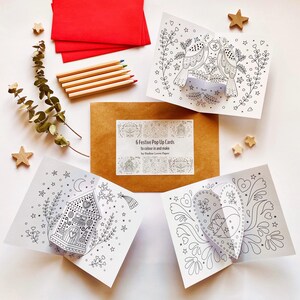 Festive pop up cards kit. 6 pop up cards to colour in & make, 2 each of 3 designs, with 6 red envelopes. Card making kit. Kids paper craft.