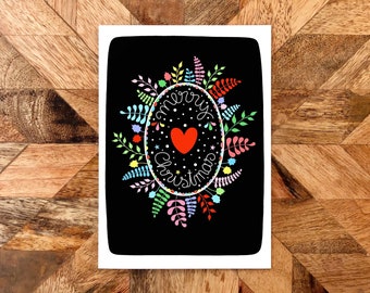 Rainbow Christmas wreath and heart on black card. Winter foliage wreath. Merry Christmas. Mistletoe and holly wreath.