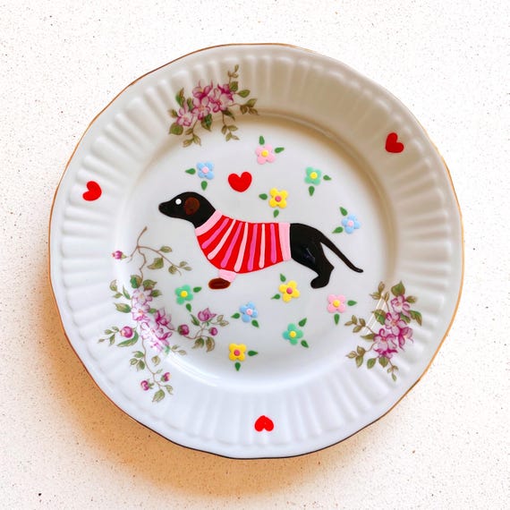Vintage plate with a cute hand painted dachshund in a red striped jumper and flowers. Decorative wall plate.