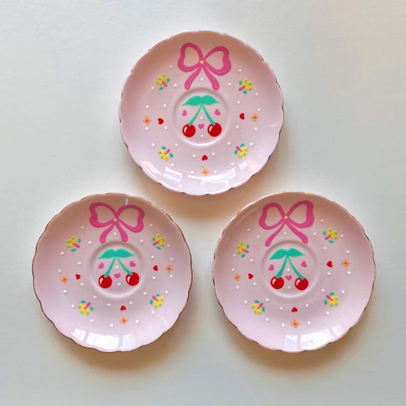 One vintage porcelain plate hand painted with cute cherries and a bow. Decorative wall plate