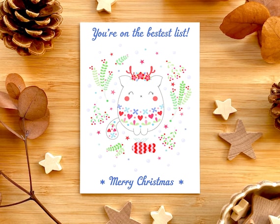 You’re on the bestest list! Cute cat Christmas card. Cute cat with a fair isle jumper and reindeer headband. Cat in a Christmas jumper.
